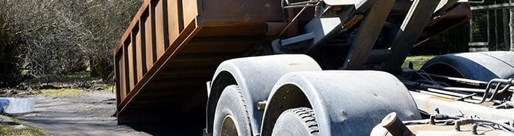 Truck roll-off dumpster